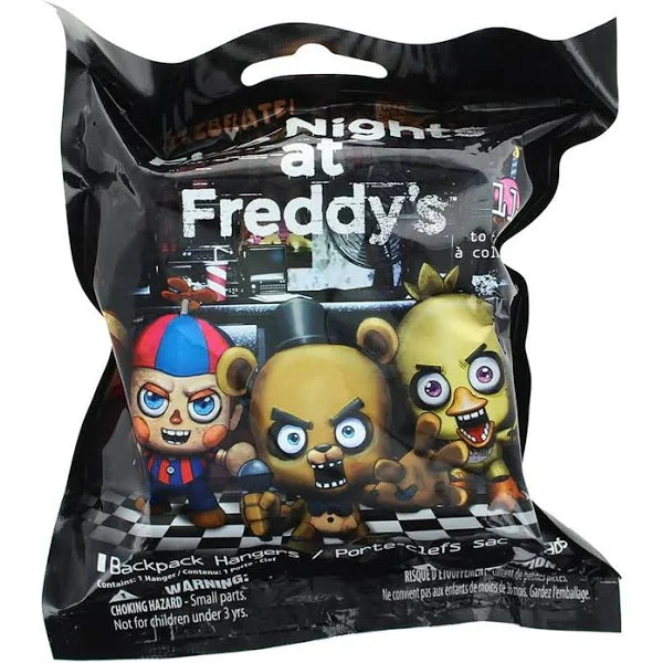 Packaging for the "Just Play Five Nights at Freddy's Hanger Bag" featuring cartoonish figures of the game's characters. The bag is black with a visible warning about small parts.